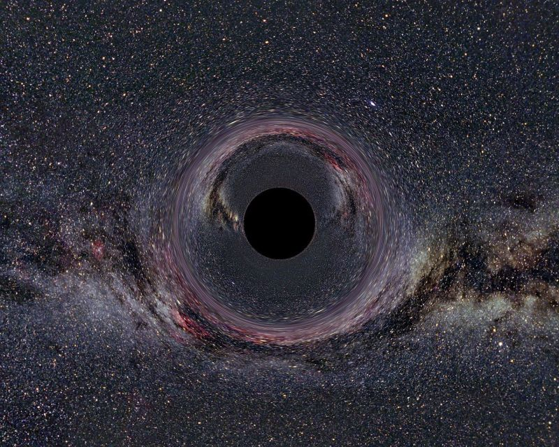 Simulación de un agujero negro con una masa de diez soles, a una distancia de 600 kilómetros, con la vía láctea al fondo. Wikimedia Commons